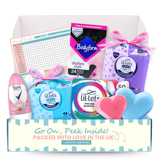 A comprehensive Monthly Period Self Care Subscription Box featuring a 14-pack of Lil-Lets Teen Smartfit Day Pads, a 10-pack of Lil-Lets Teen Smartfit Night Pads, a 50-pack of Lil-Lets Essentials Panty Liners, a 26-pack of Bodyform Dailies Black Normal Panty Liners, a 50ml Sure Roll-On Deodorant, a 70g Love Heart Bath Bomb in blue baby powder scent, and a Pink Cloud Guest Soap with a marshmallow fragrance.