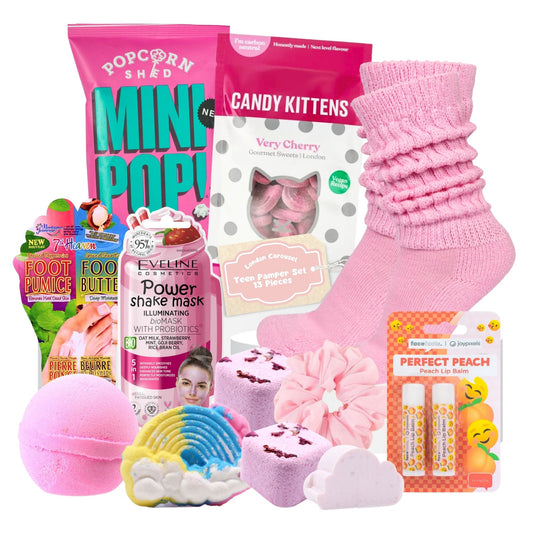 Pamper Party Box featuring a variety of spa-themed items including games, headband, masks, nail stickers, eye palette, hair chalk pens, lip balm, hair scrunchie, sweet bags, popcorn, candy rolls, treat bags, fizzy rollers, paper bags, and tissue paper.